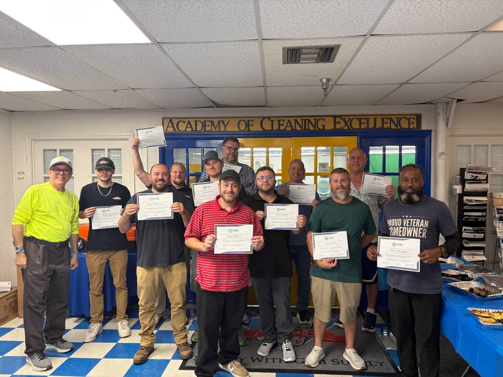 Academy students displaying earned certificates